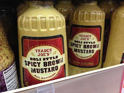 Spicy Mustard jars at Trader Joes display the Wildwash font from the Wild West Press font set